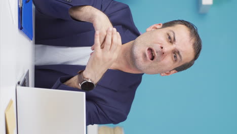 Vertical-video-of-Happy-and-peaceful-businessman-talking-to-camera.